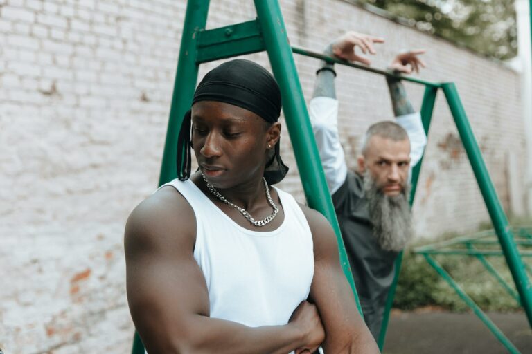 Muscular Man and Bearded Man in Jail Yard